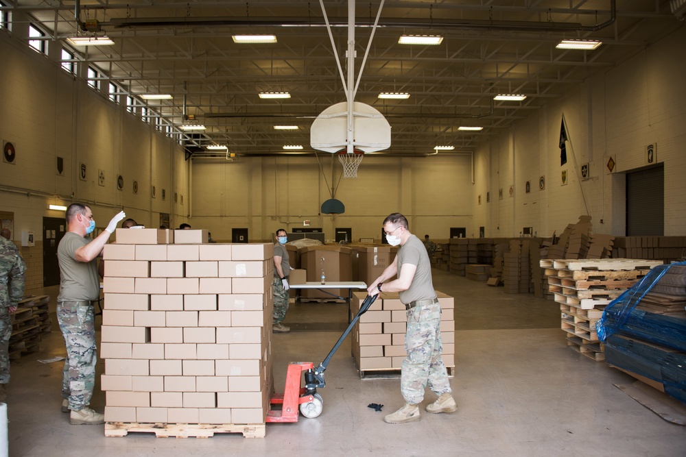 Kansas Army National Guard Soldiers prepare hunger relief boxes for Wichita Food Bank