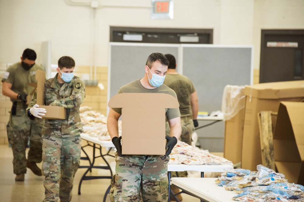 Kansas Army National Guard Soldiers prepare hunger relief boxes for Wichita Food Bank