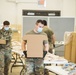 Kansas Army National Guard Soldiers prepare hunger relief boxes for Wichita Food Bank