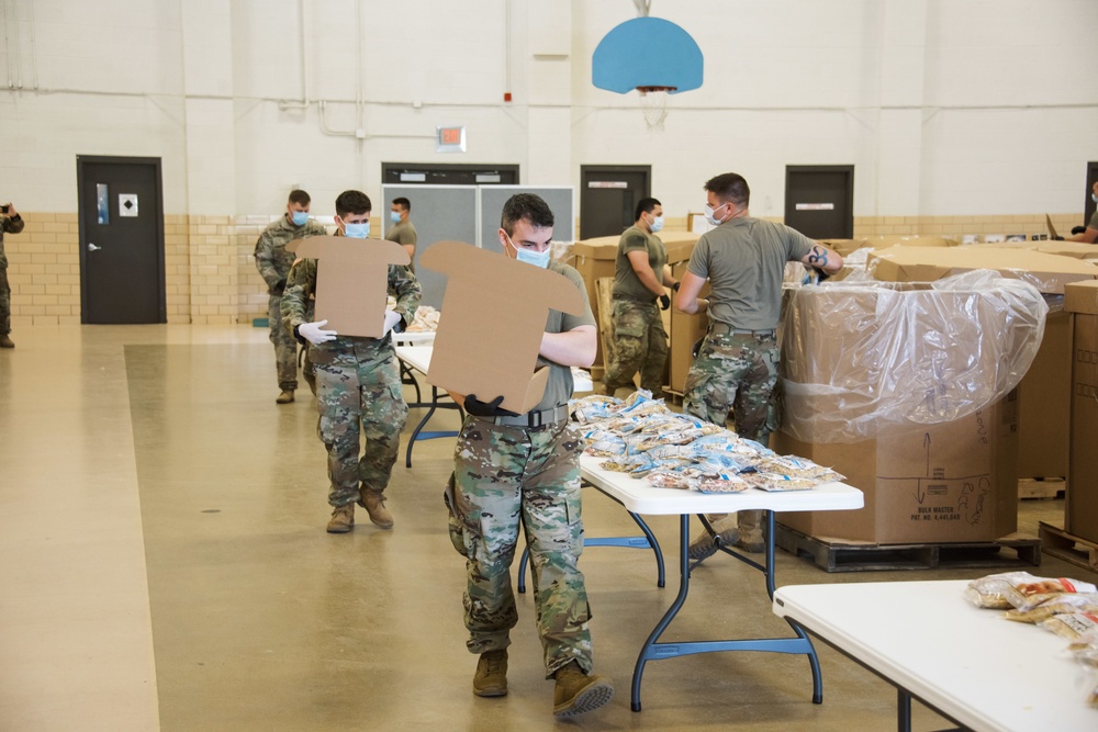 Kansas Army National Guard Soldiers prepare hunger relief boxes for Wichita Food Bank