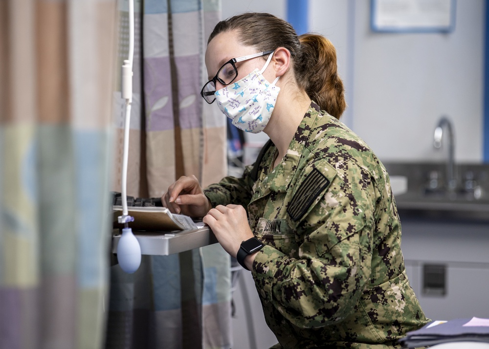 USNS Mercy Sailor Works in Sick Call Ward
