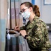 USNS Mercy Sailor Works in Sick Call Ward
