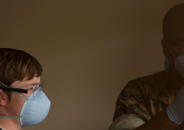 3rd Medical Battalion staff check USS Theodore Roosevelt Sailors for COVID-19 symptoms