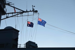 Flags from Australia and New Zealand are hoisted during the 105th Australian and New Zealand Army Corps (ANZAC) Day ceremony