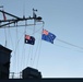 Flags from Australia and New Zealand are hoisted during the 105th Australian and New Zealand Army Corps (ANZAC) Day ceremony