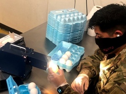 North Carolina Guardsmen "Candle" thousands of eggs helping impacted families of COVID-19