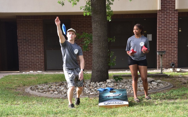 First Four Hosts Morale Cookout for Dorm Residents
