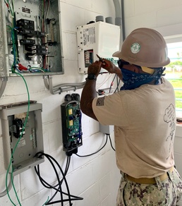 Seabees with NMCB-5, Detail Marshall Islands, provide electricity to Ennibur’s medical clinic and police station