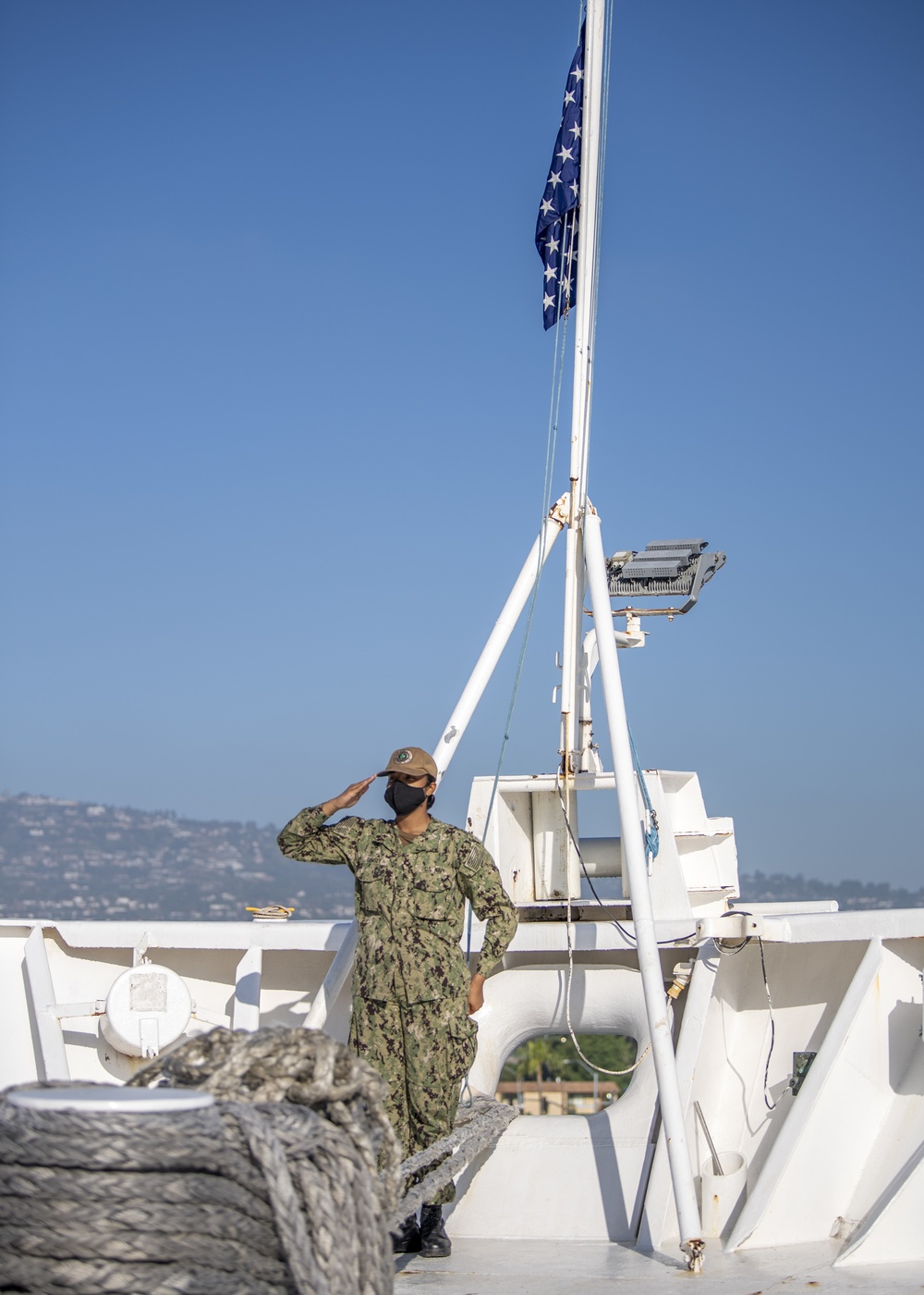 USNS Mercy Sailor Renders Hand Salute