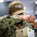 USNS Mercy Sailor Works in Bio Med