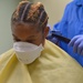 USNS Mercy Sailor Receives Haircut