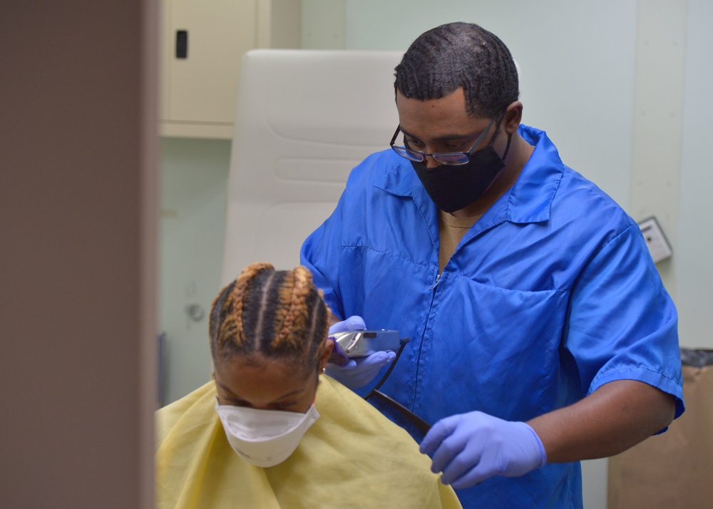 USNS Mercy Sailor Receives Haircut