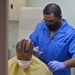 USNS Mercy Sailor Receives Haircut