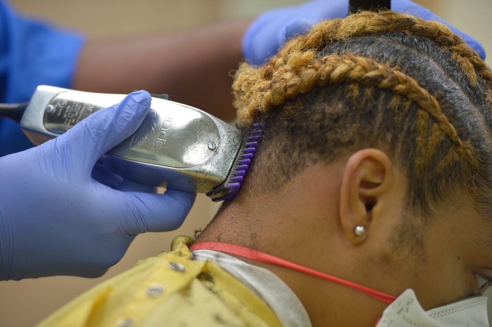 USNS Mercy Sailor Receives Haircut