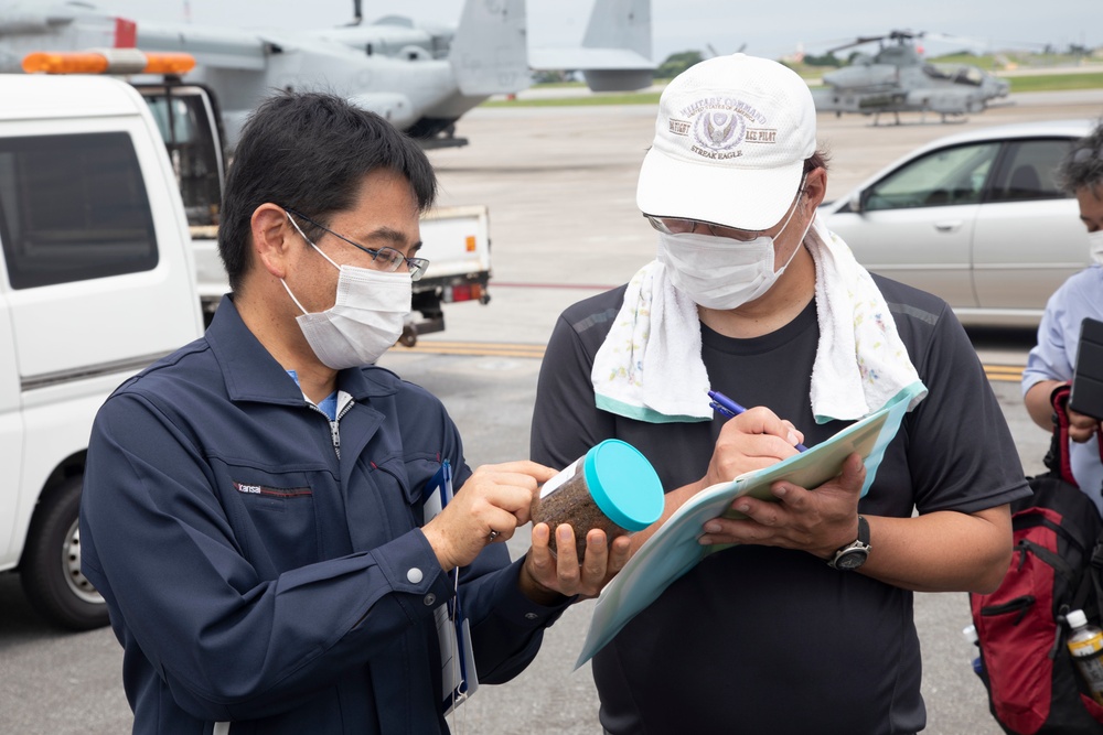 Members of the Okinawan Government Sample Soil on MCAS Futenma