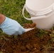 Members of the Okinawan Government Sample Soil on MCAS Futenma