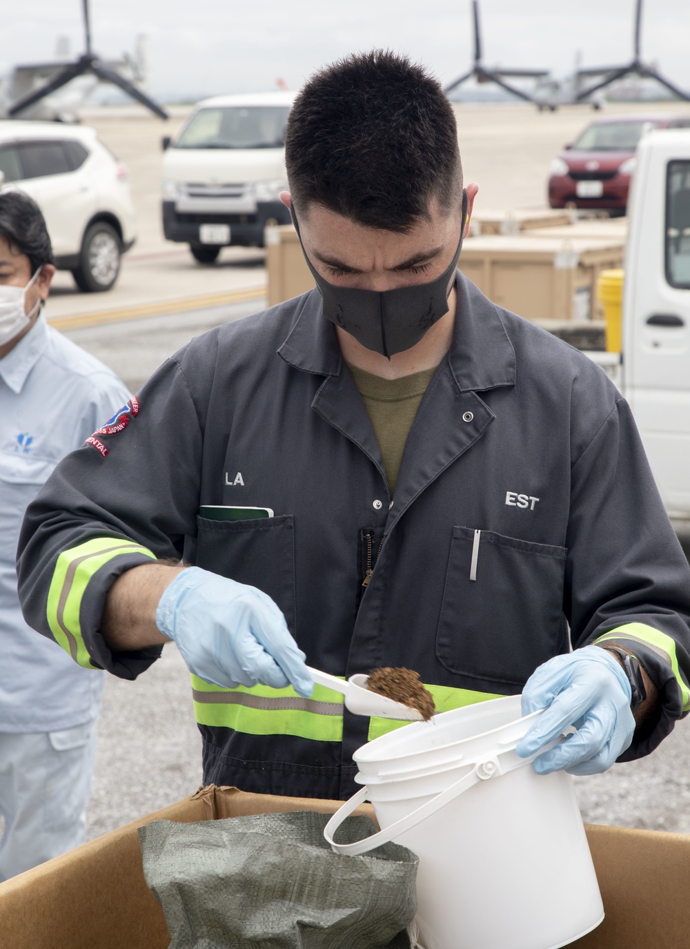 Members of the Okinawan Government Sample Soil on MCAS Futenma