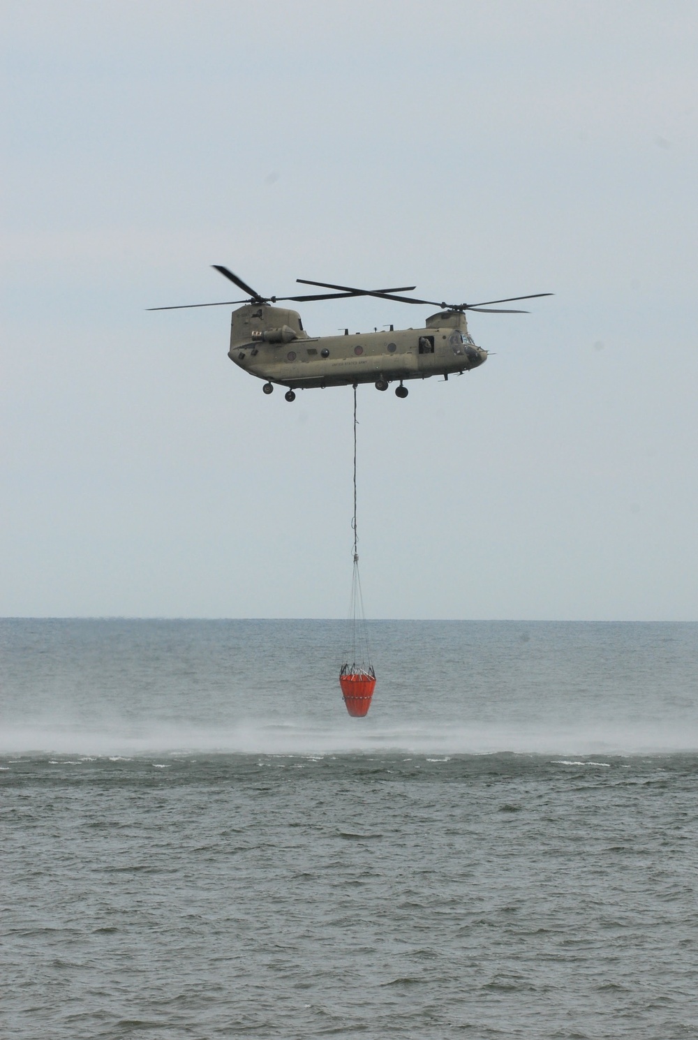 NY Army National Guard helicopter crews conduct water bucket training over Lake Ontario