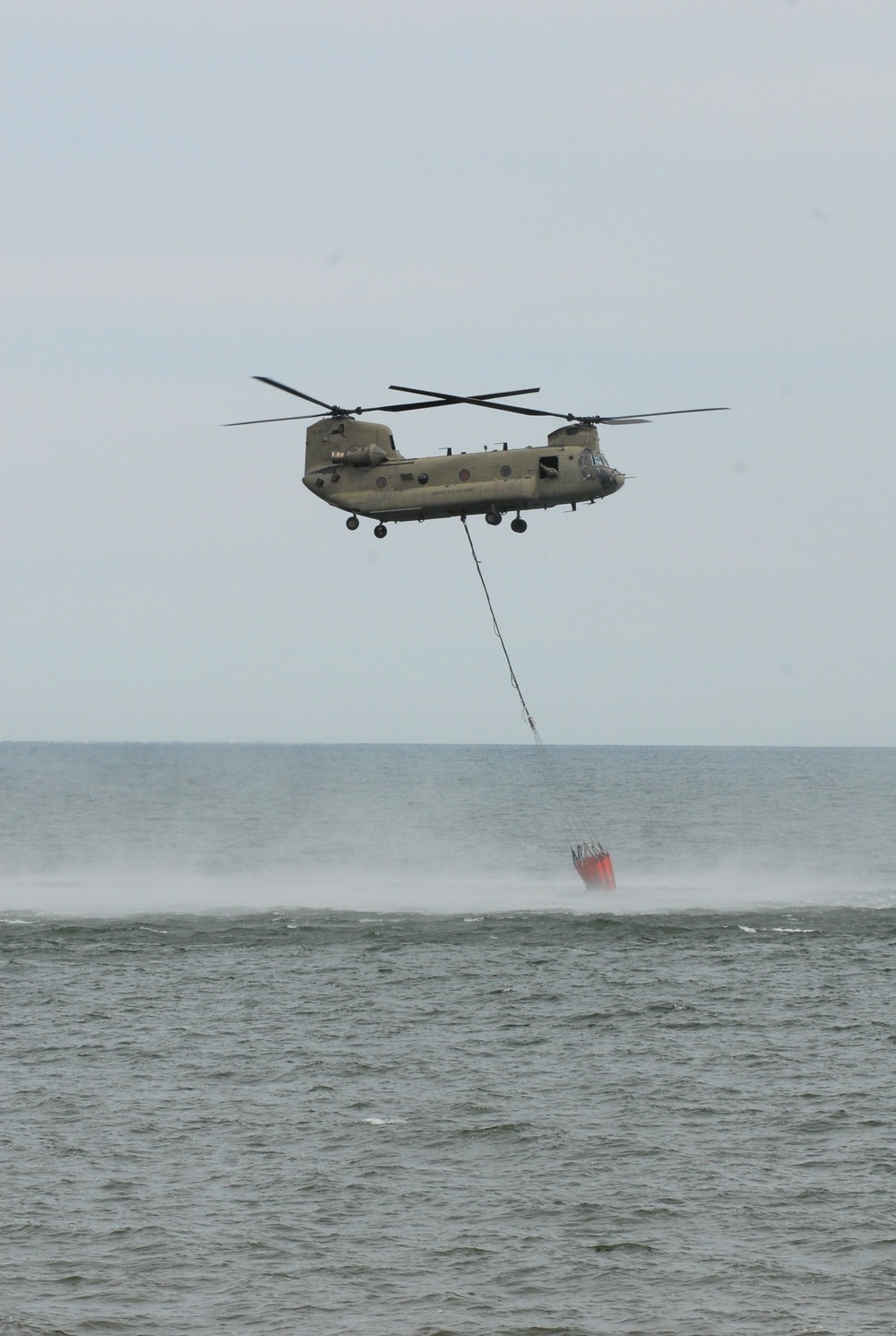 NY Army National Guard helicopter crews conduct water bucket training over Lake Ontario