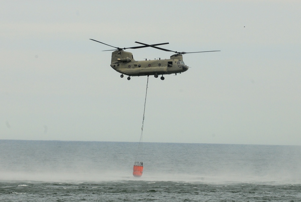 NY Army National Guard helicopter crews conduct water bucket training over Lake Ontario