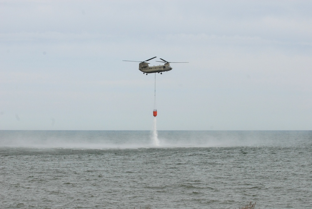 NY Army National Guard helicopter crews conduct water bucket training over Lake Ontario