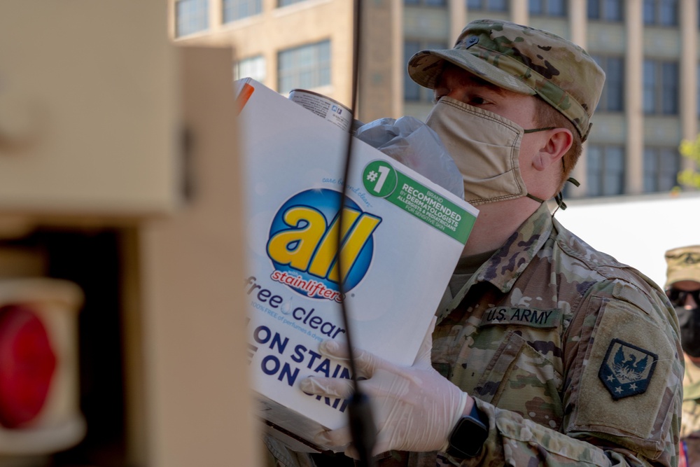 Soldiers load donated groceries