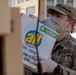 Soldiers load donated groceries