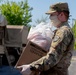 Soldiers load donated groceries
