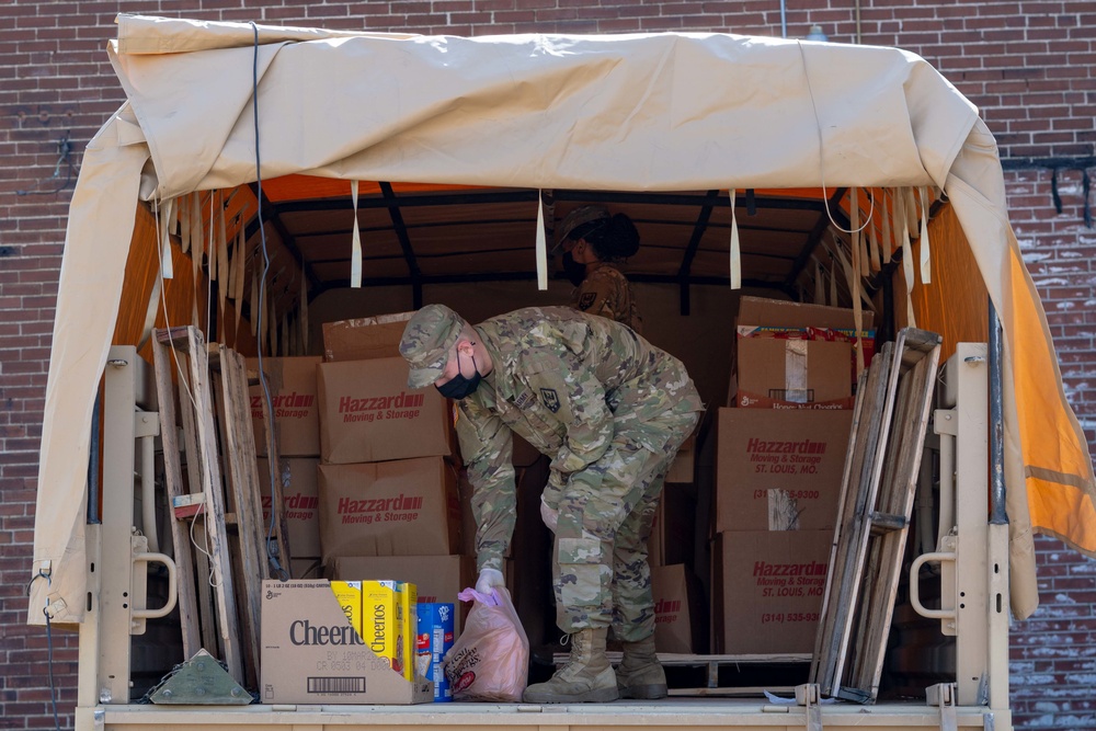 Soldiers load donated groceries