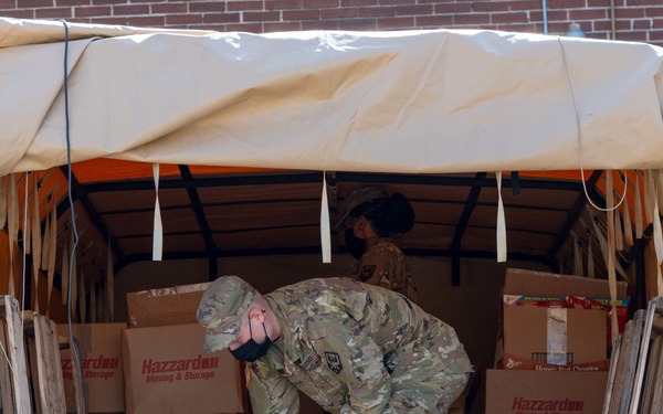Soldiers load donated groceries