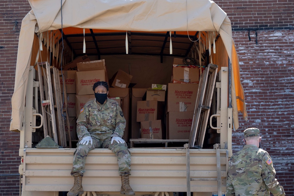 Soldiers load donated groceries