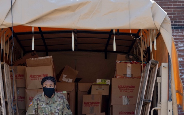 Soldiers load donated groceries