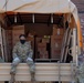 Soldiers load donated groceries