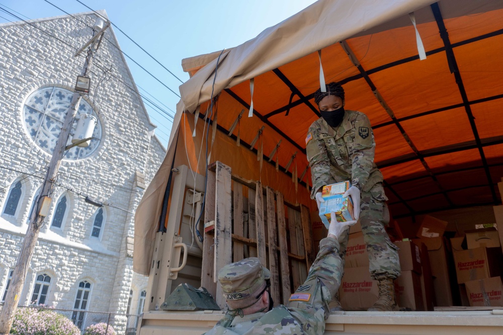 Soldiers load donated groceries