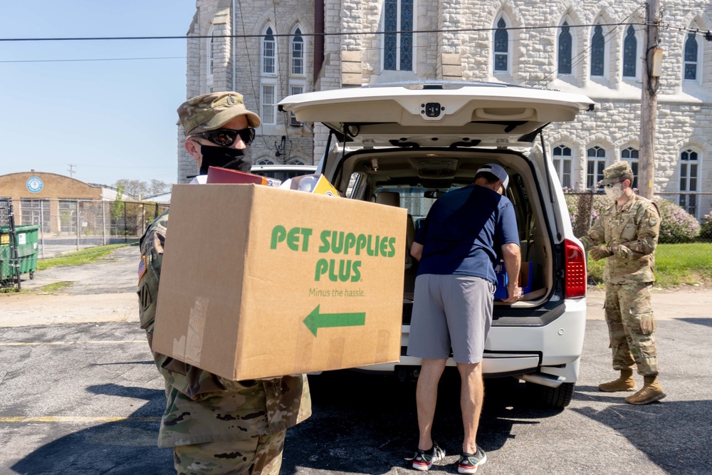 Soldiers load donated groceries