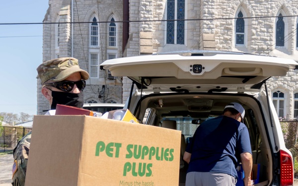 Soldiers load donated groceries