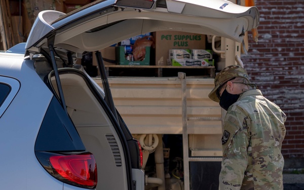 Soldiers load donated groceries