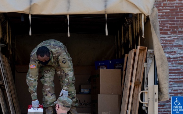 Soldiers load donated groceries