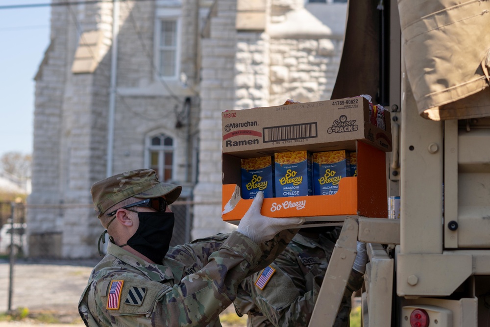 Soldiers load donated groceries