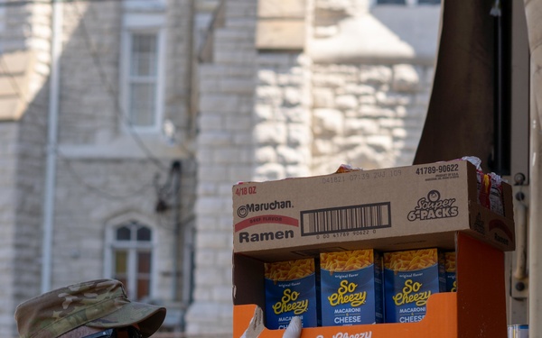 Soldiers load donated groceries