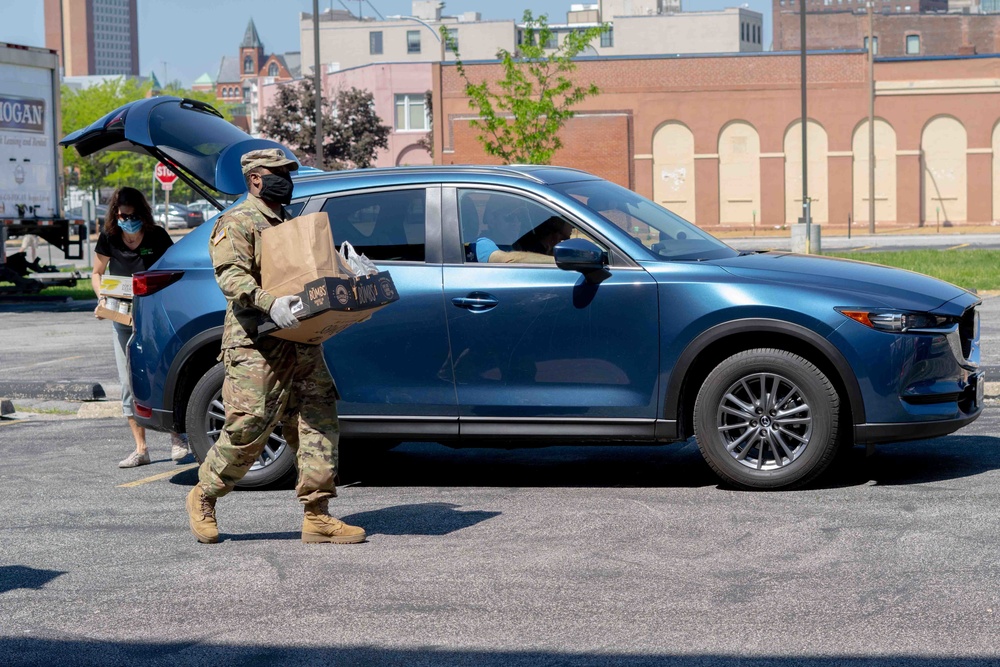 Soldiers load donated groceries