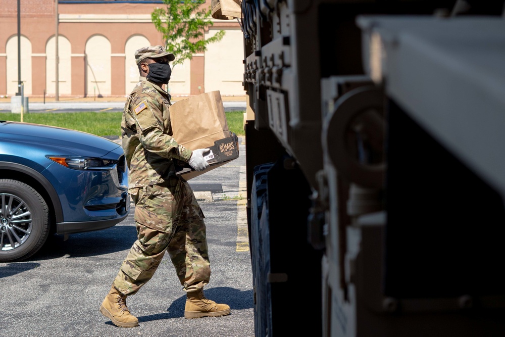 Soldiers load donated groceries
