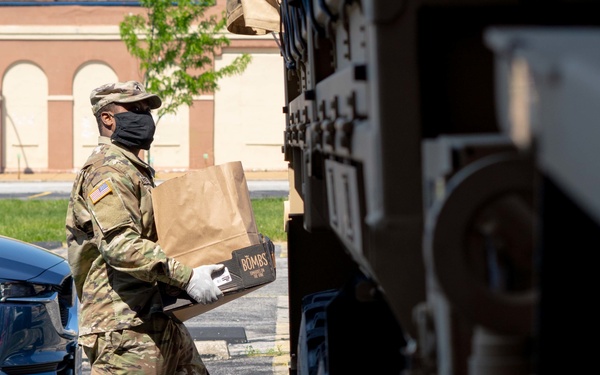 Soldiers load donated groceries