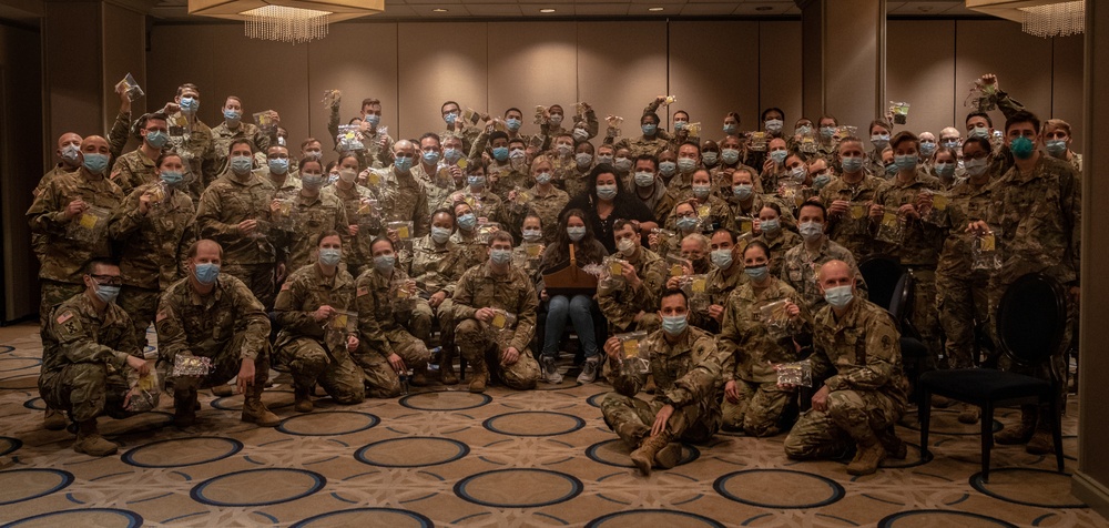 Sophia Farid hands out masks she made for military personnel