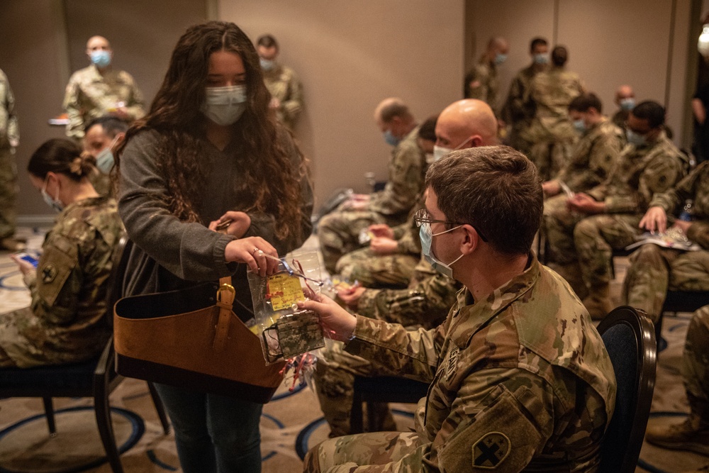 Sophia Farid hands out masks she made for military personnel