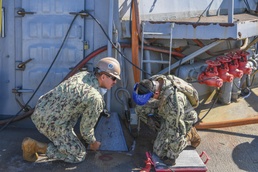 Seabees Work aboard USS Hopper