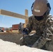 U.S. Navy Seabees deployed with NMCB-5’s Detail Sasebo are construct buildings for Naval Beach Unit 7