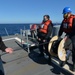 USS Ralph Johnson Conducts Replenishment At Sea