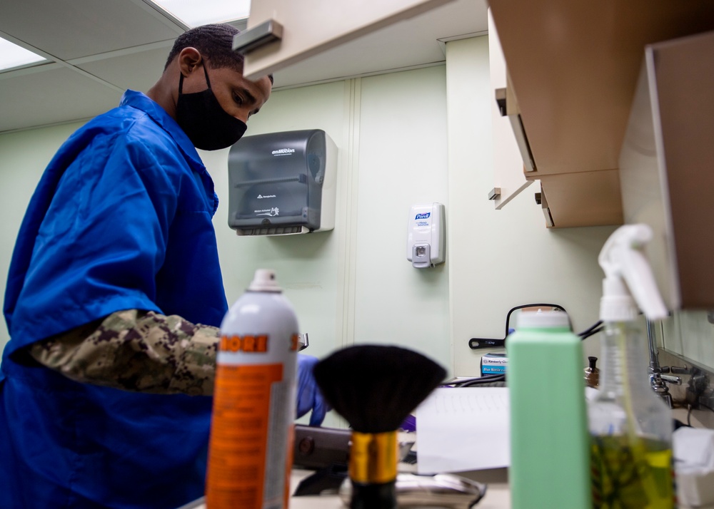USNS Mercy Sailor Works in the Barbershop