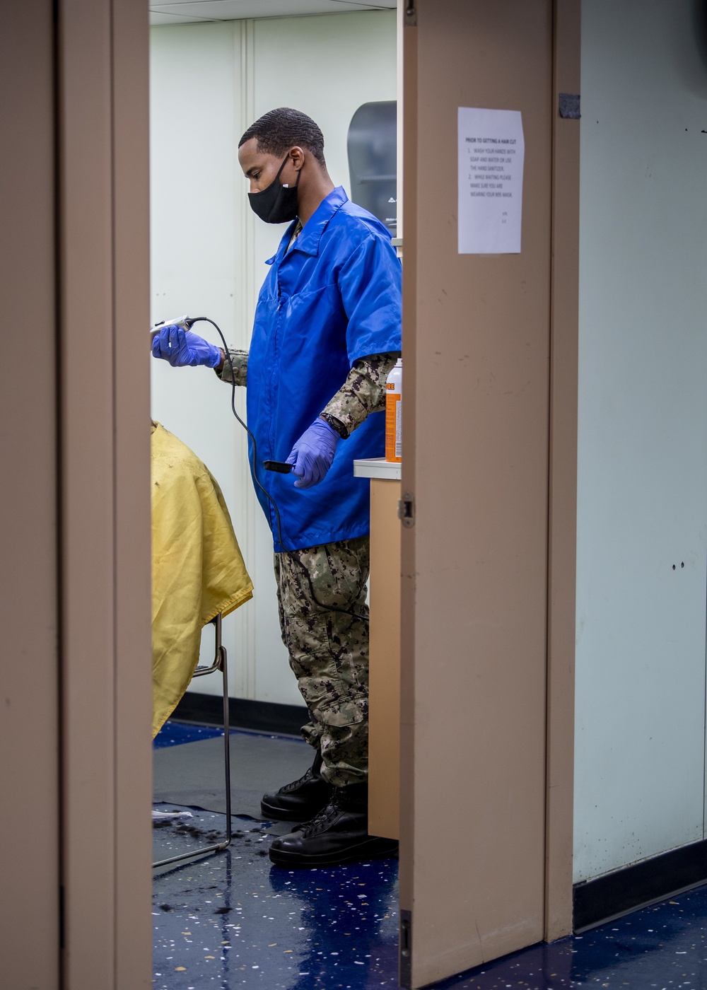 USNS Mercy Sailor Works in the Barbershop
